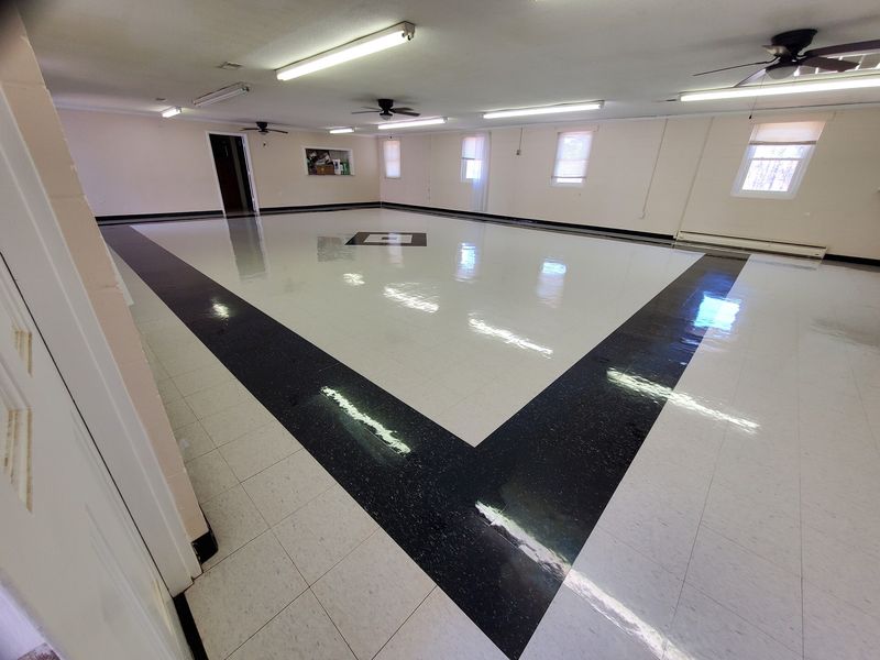 Church fellowship hall tile floor after strip and wax
