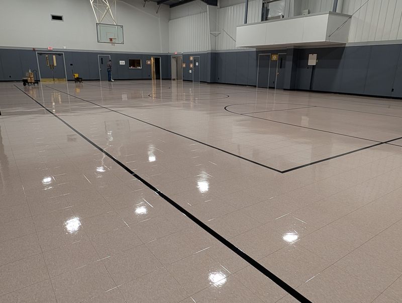 Church gym tile floor with court lines, freshly polished